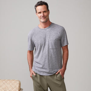 Front view of model wearing the textured tri-blend relaxed pocket crew in granite.